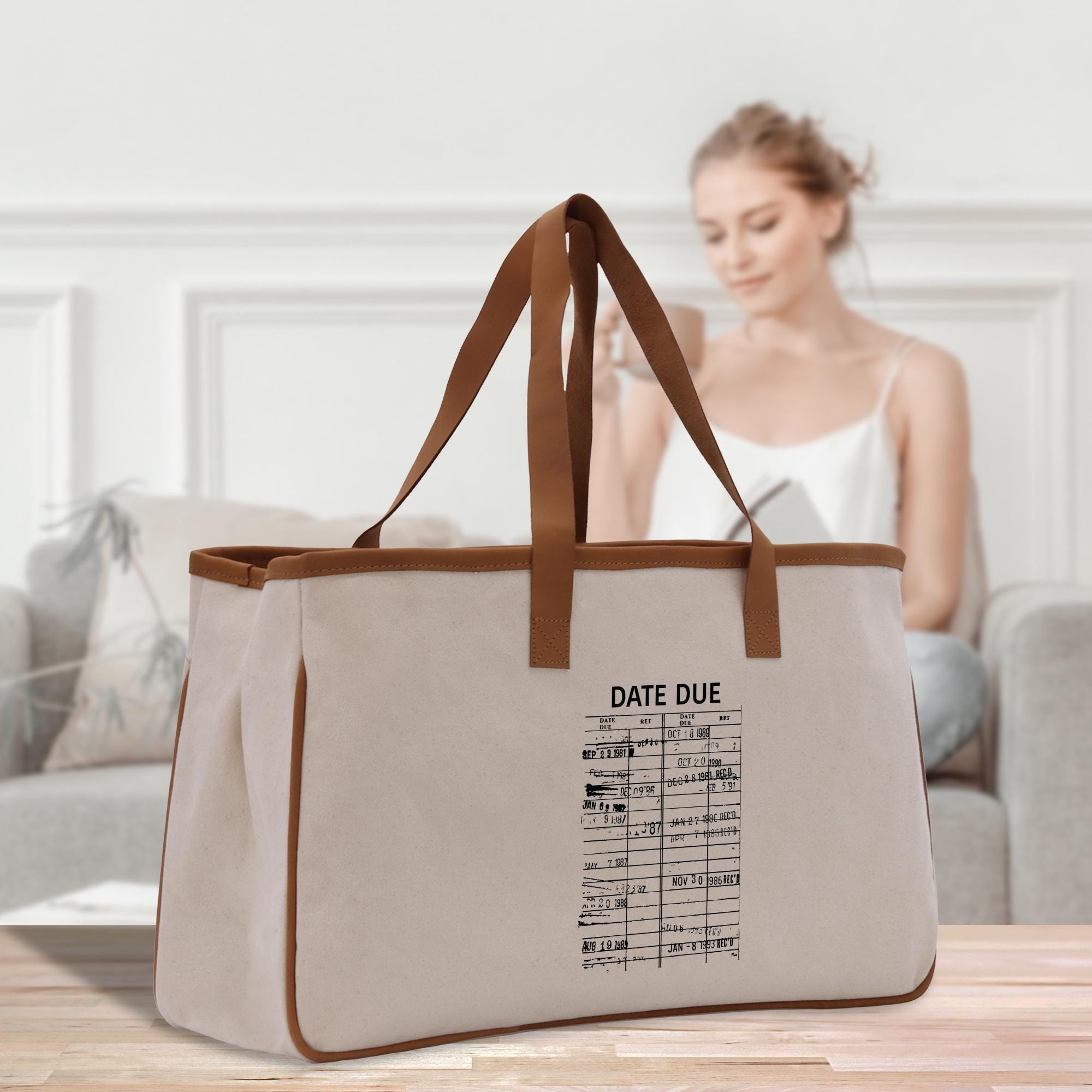 a woman sitting on a couch with a large bag
