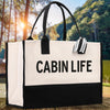 A large black and white tote bag with the text 