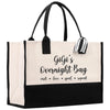 a black and white shopping bag with a bow on it