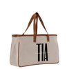 a canvas tote bag with the word at on it