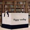 a large white bag with the words happy reading printed on it