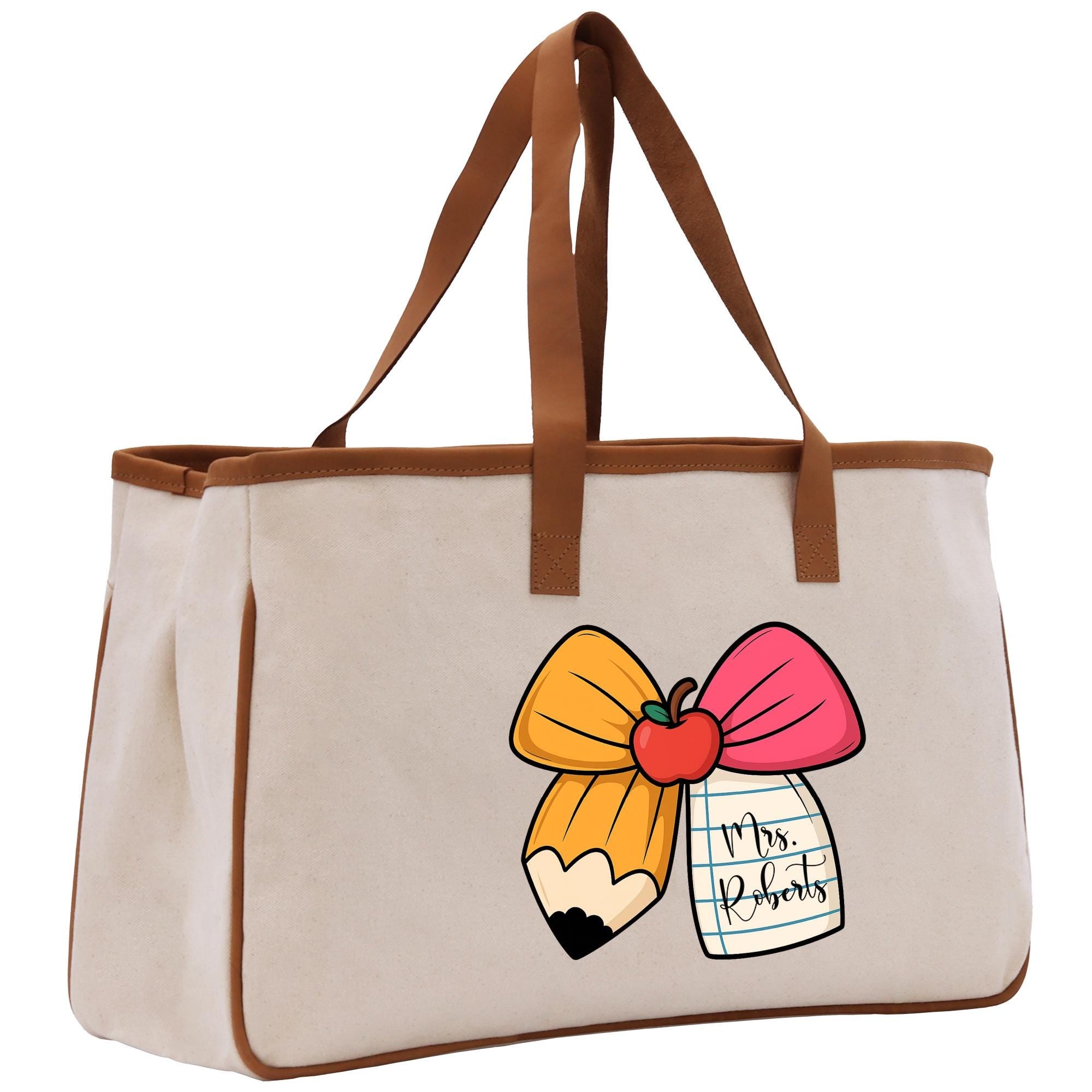 A beige canvas tote bag with a cartoon pencil and a bow on it, featuring the text &quot;Mrs. Roberts&quot; printed on it.