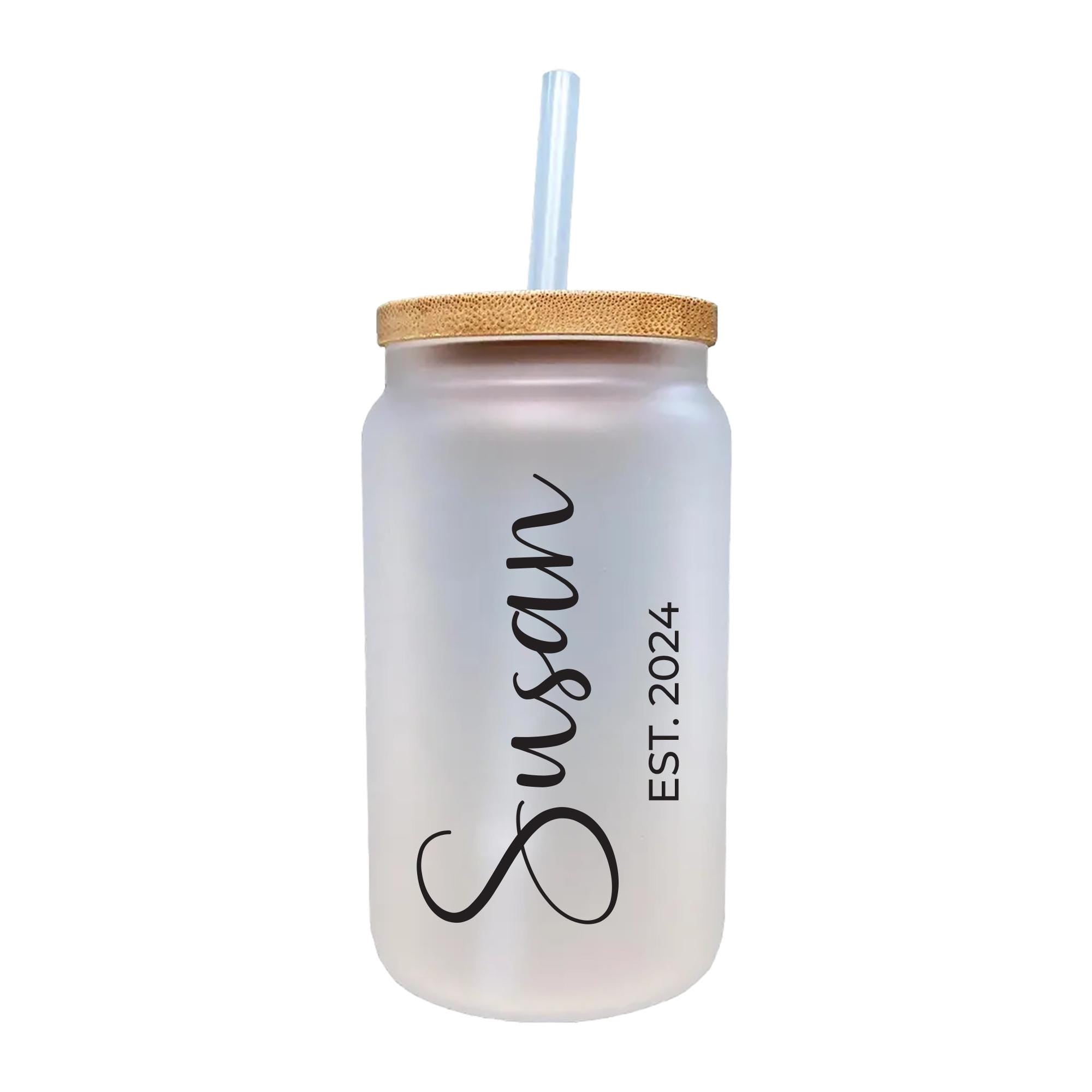 a white mason jar with a straw in it