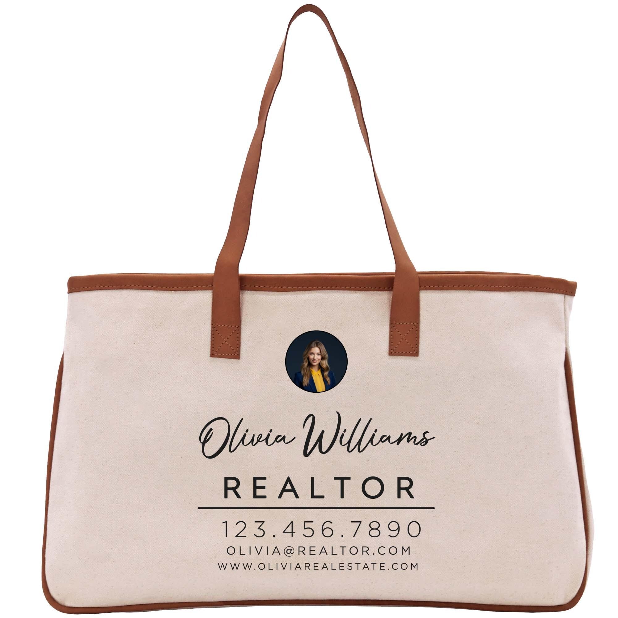 a white canvas bag with a brown leather handle