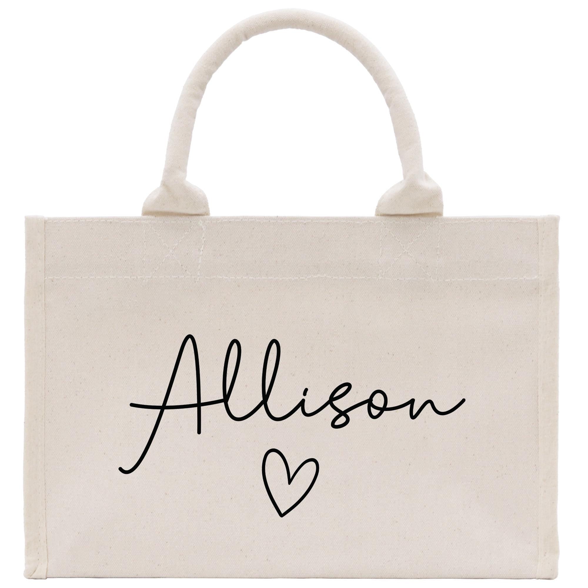 a white bag with a heart and name on it