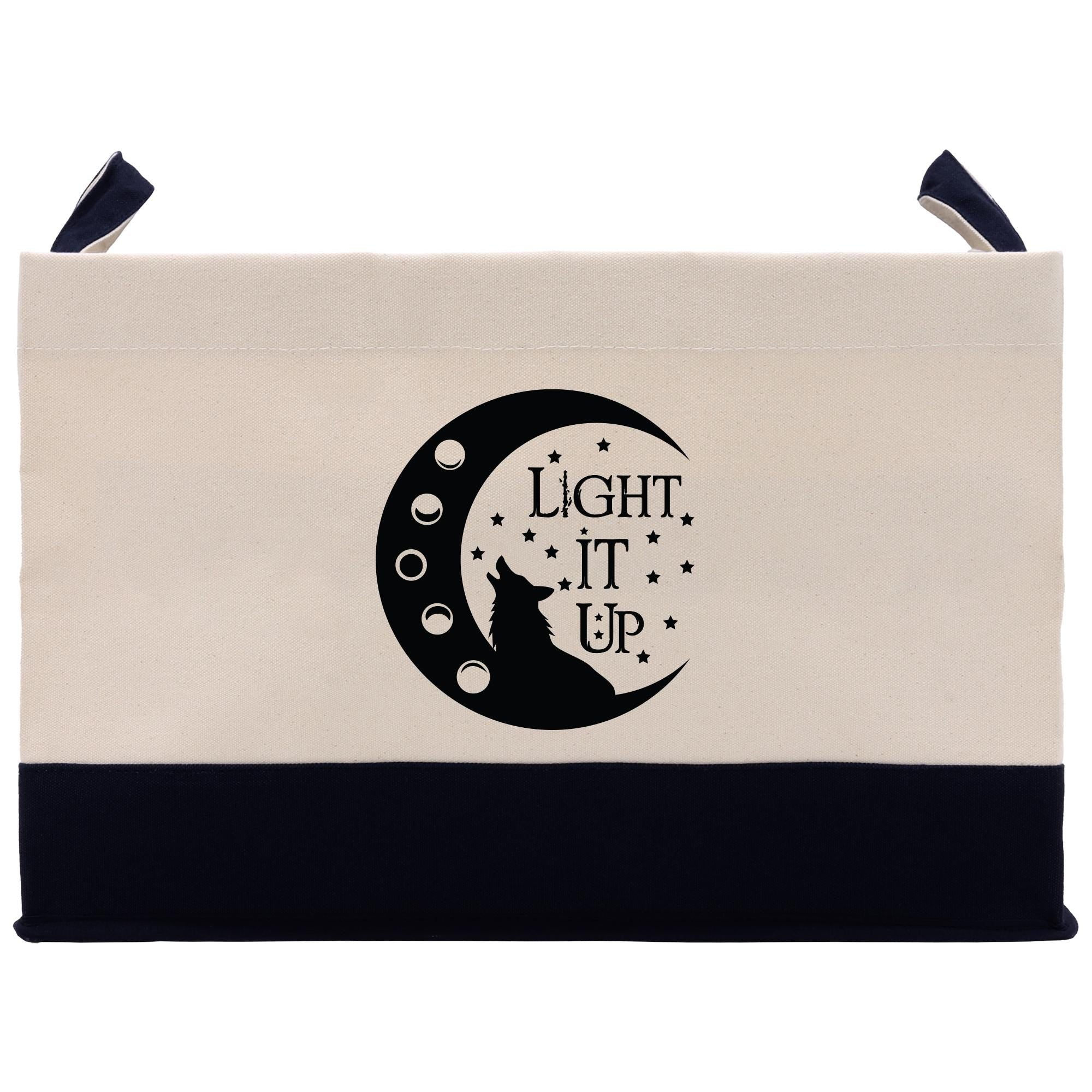 a black and white bag with a cat sitting on the moon