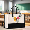 A white tote bag with a black handle and a colorful bow on it, placed on a wooden surface.
