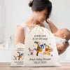 A woman holding a baby, with a large white bag featuring illustrations of Winnie the Pooh and a baby shower message.