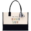 A tote bag with a black and white striped ribbon attached to it, featuring a message that says "Mrs. Parker's Teacher Stuff".