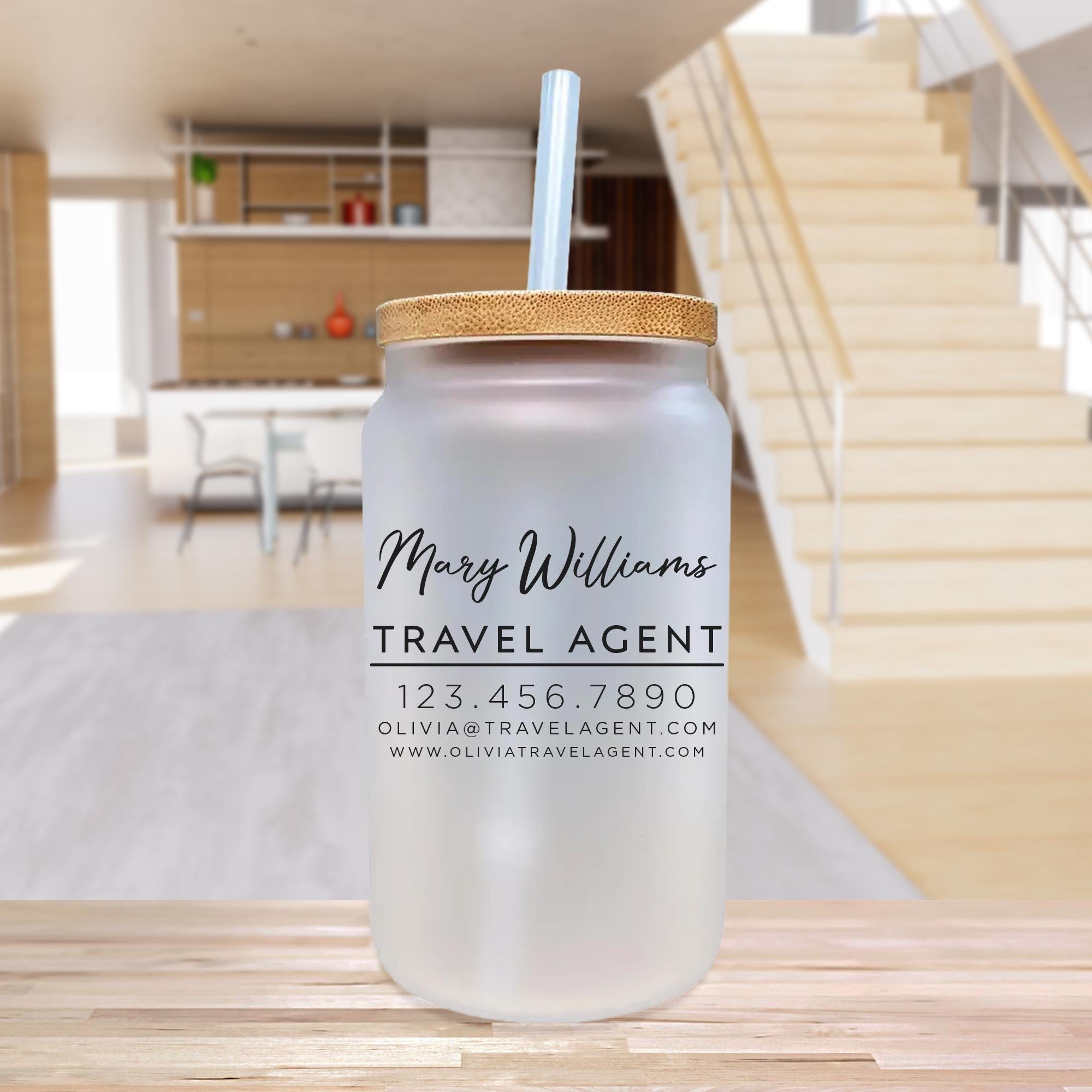 a glass jar with a straw in it sitting on a table