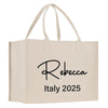 a white shopping bag with a black logo on it