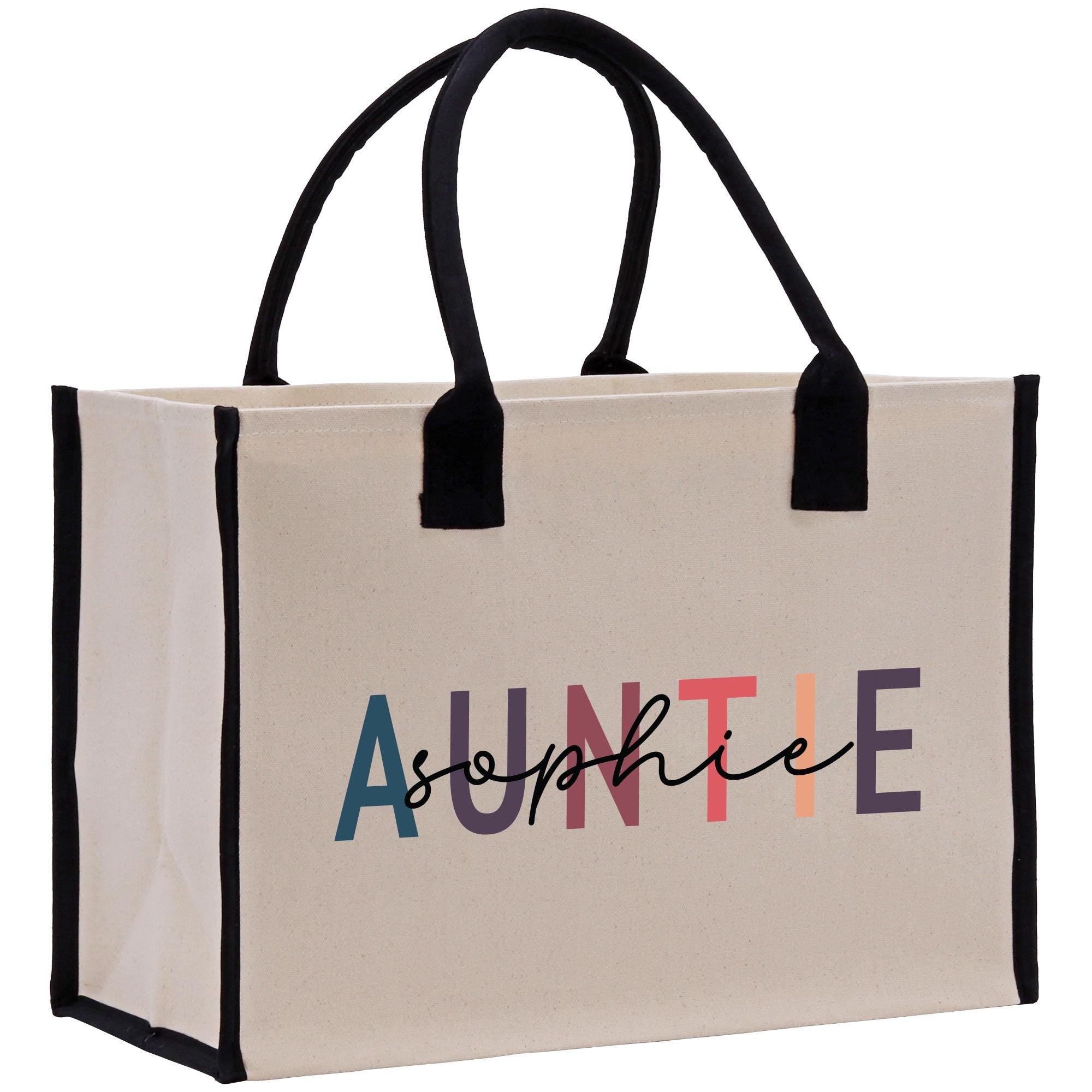 a white bag with a black handle and the word&#39;auntie&#39;printed on