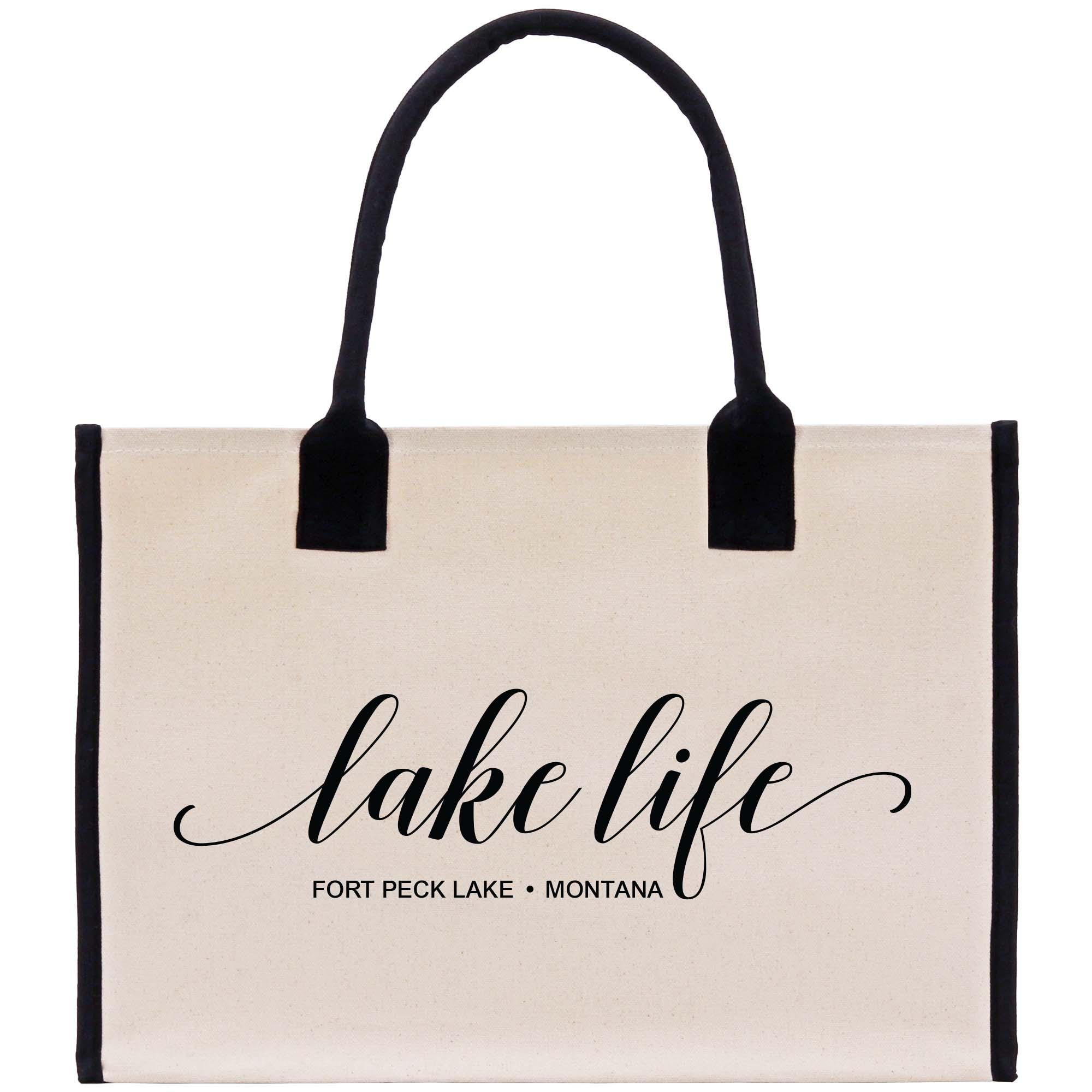 a white bag with black handles and a black handle