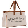a white beach bag with the words beach day with the johnson family