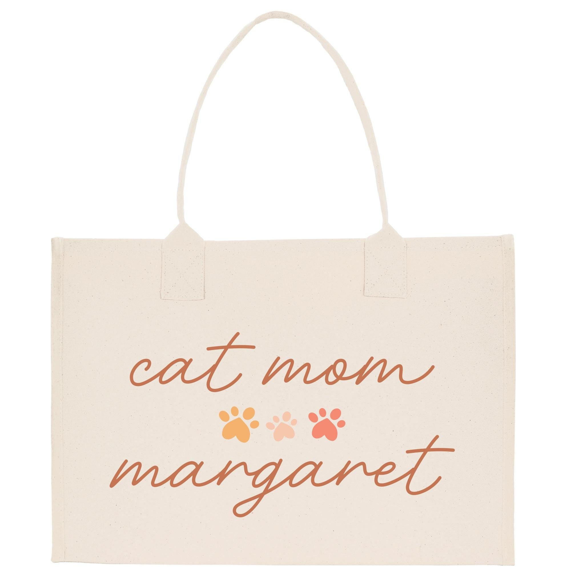 a white bag with a cat mom magnet on it