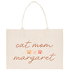 a white bag with a cat mom magnet on it