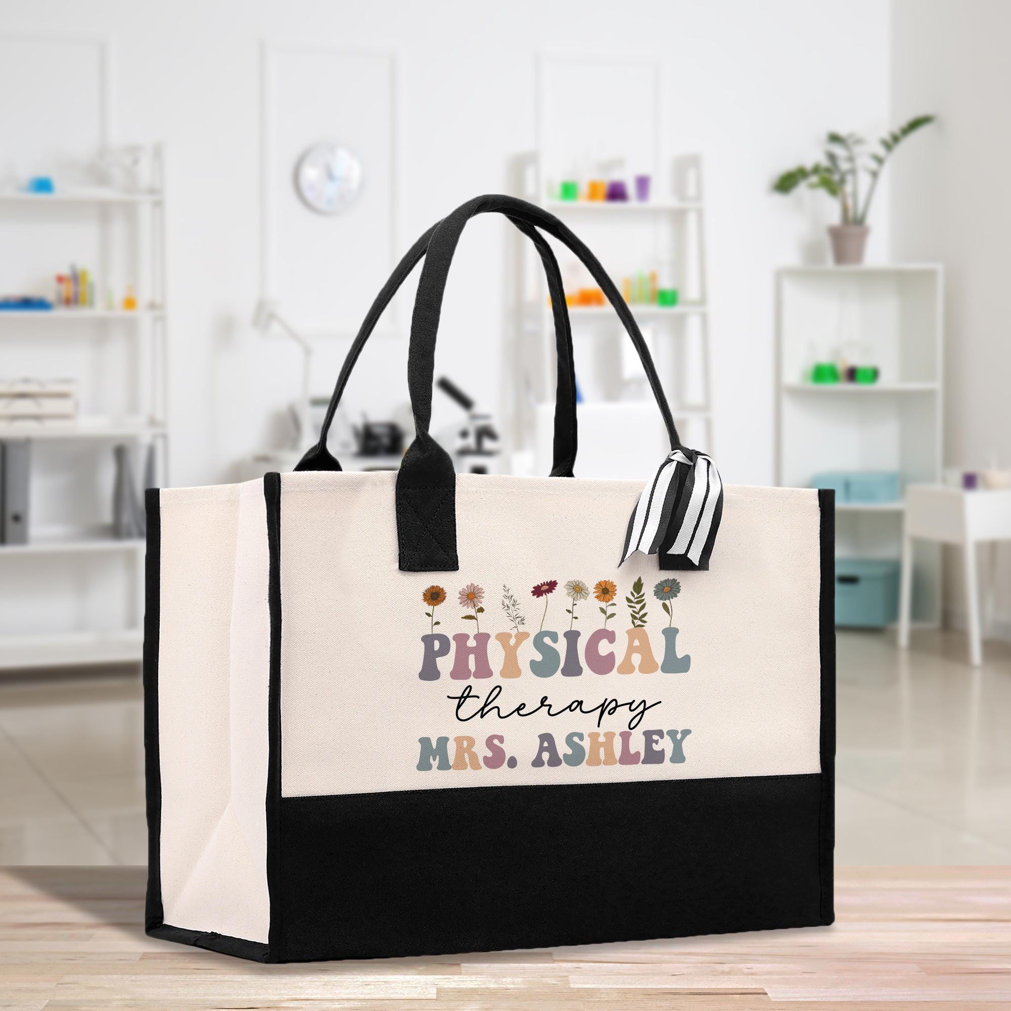 a black and white shopping bag with the words physical therapy on it