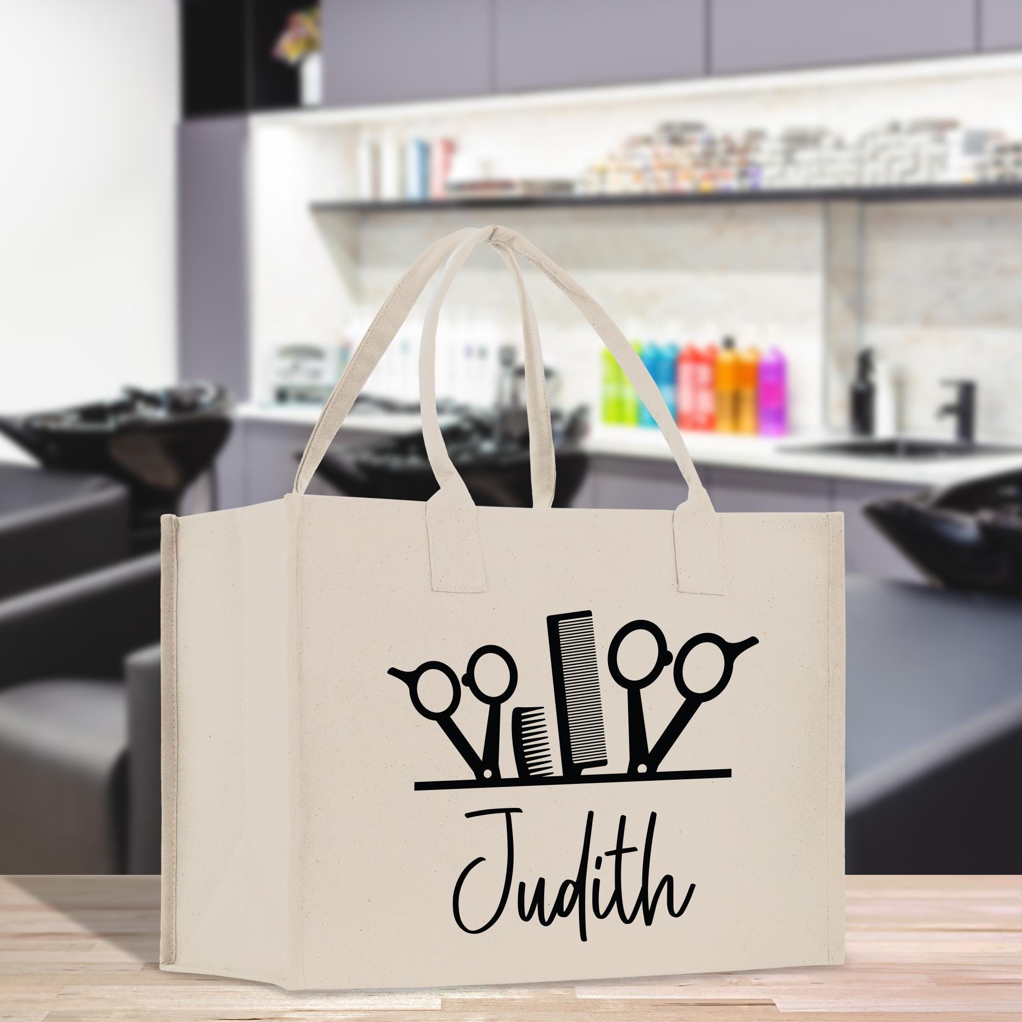 a white bag with scissors on it sitting on a table