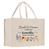 A beige canvas tote bag with a floral design and text printed on it.
