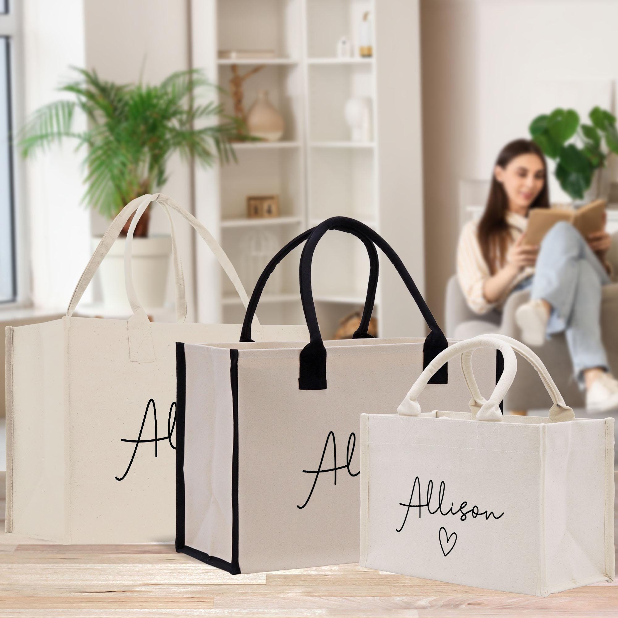 a woman sitting on a couch next to three bags