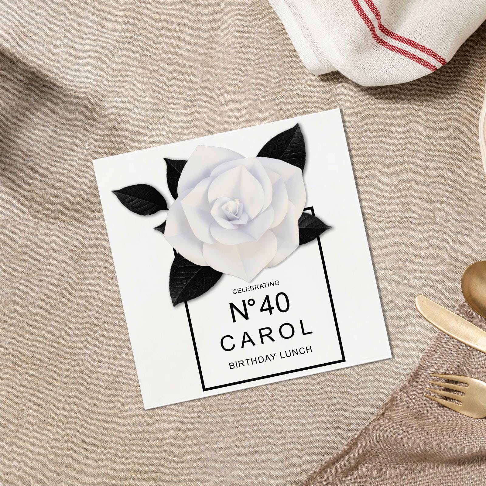 a card with a white rose on it