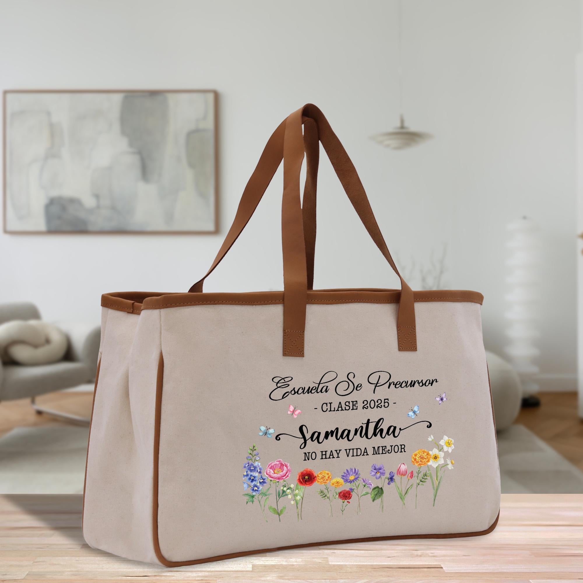A beige canvas tote bag with a floral design and text printed on it, placed on a wooden surface.