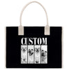 A black tote bag with a white handle and the word "CUSTOM" printed on it. The bag has a collage of four black and white photographs of dogs, each with a different expression.