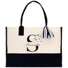 a black and white bag with a flower on it