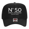A black baseball cap with white text and a small white sticker on the front.