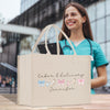 a woman holding a shopping bag with a message on it