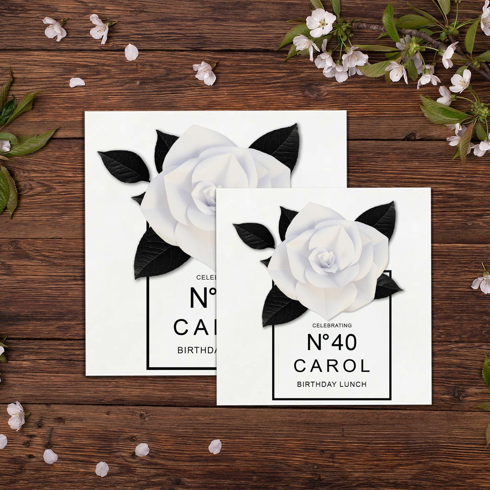 two cards with white flowers and black leaves
