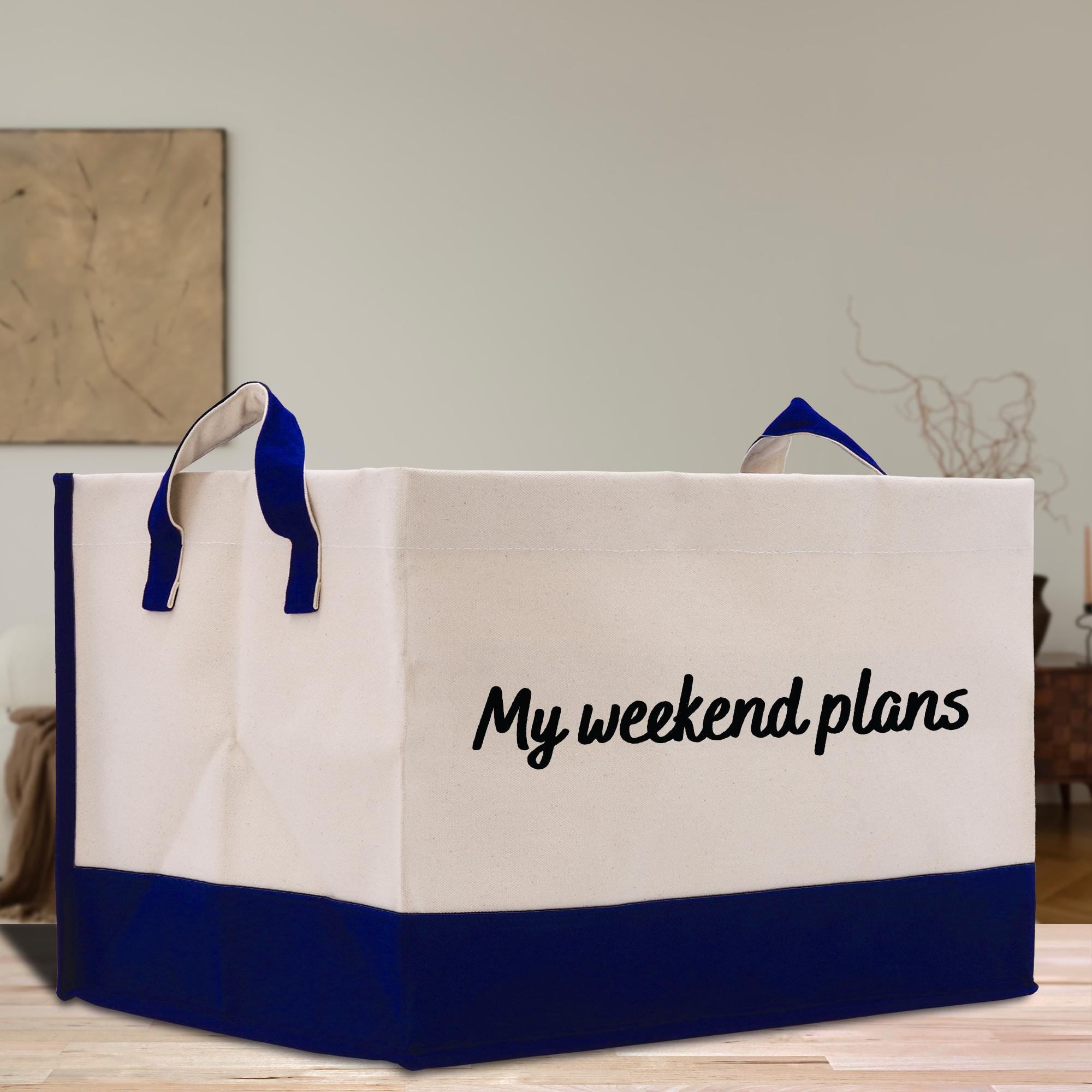a white and blue shopping bag sitting on top of a wooden table