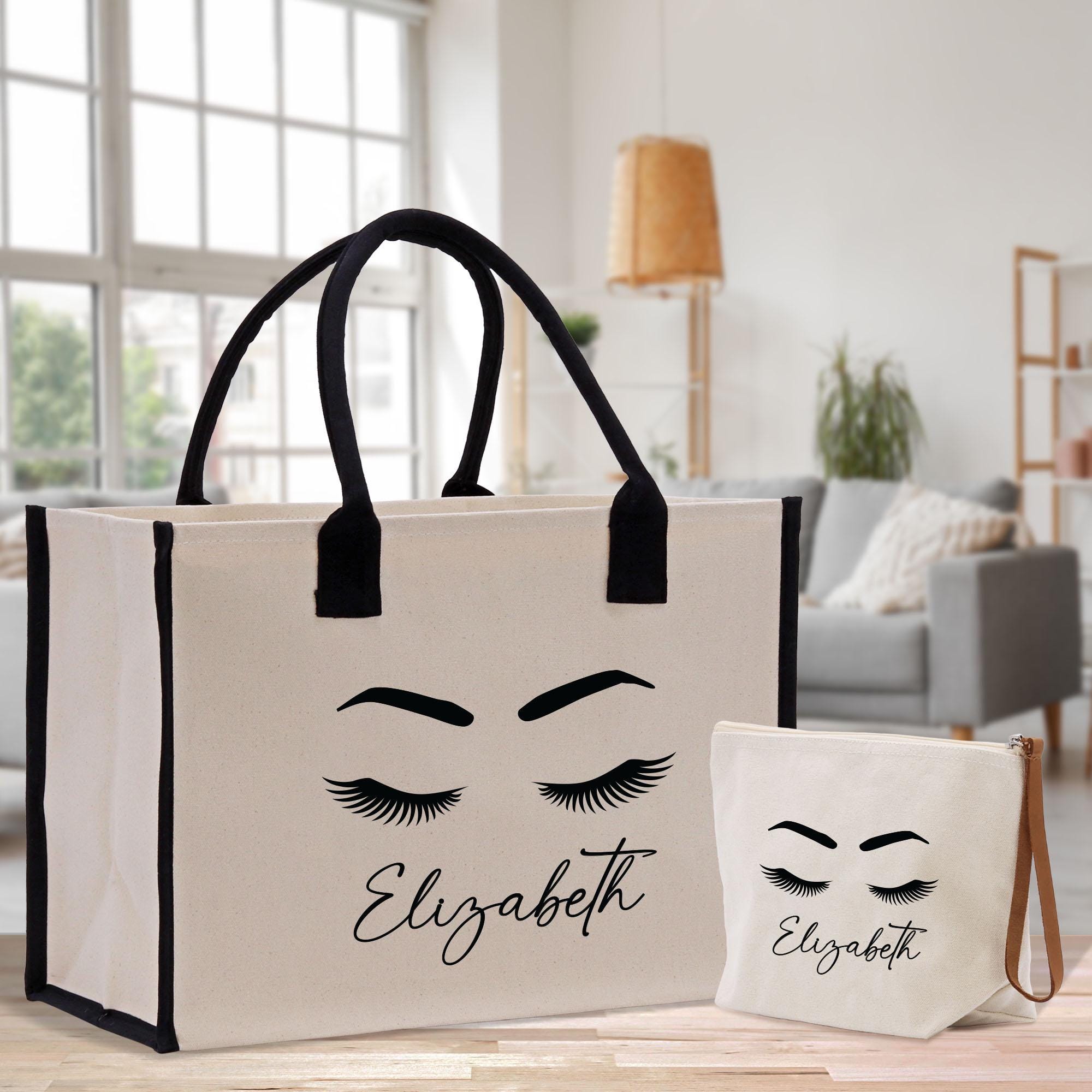 a bag with a face drawn on it next to a bag with eyelashes