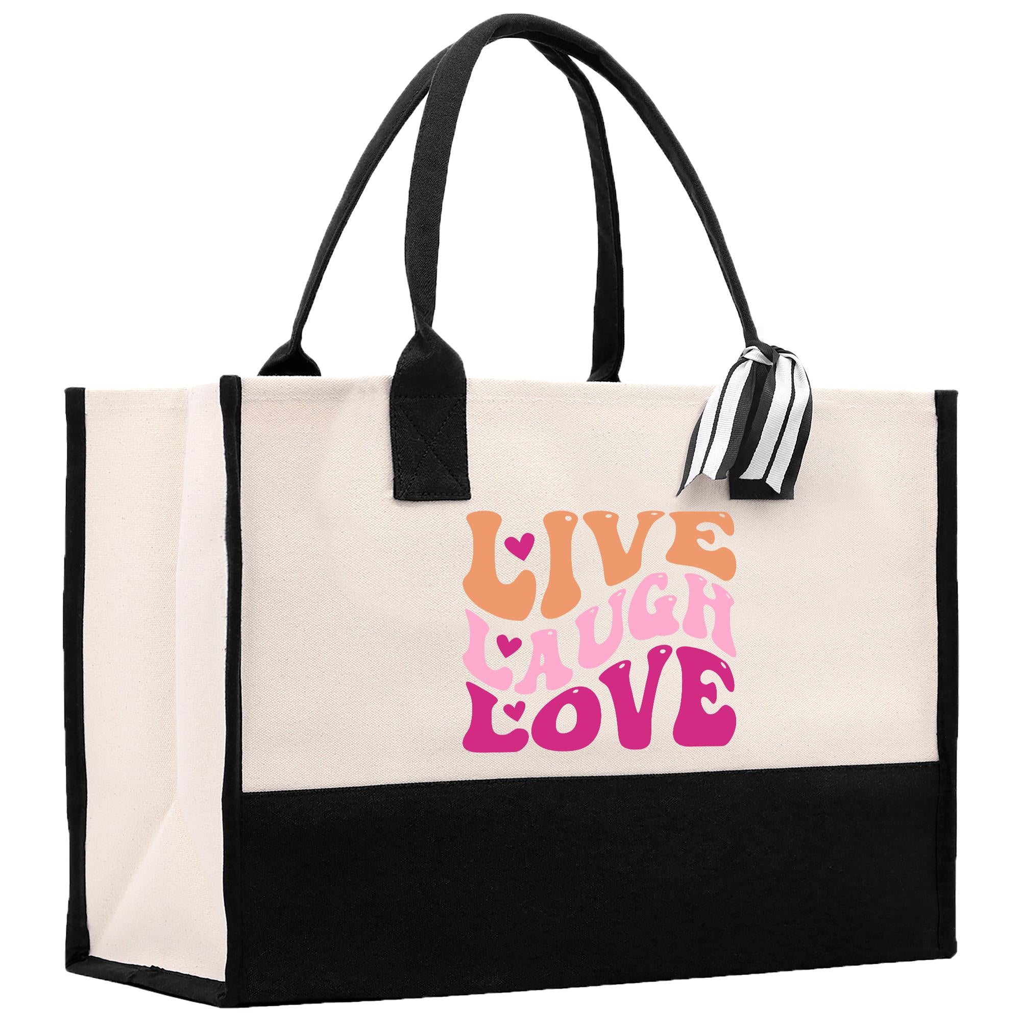 a black and white bag with a pink and orange design