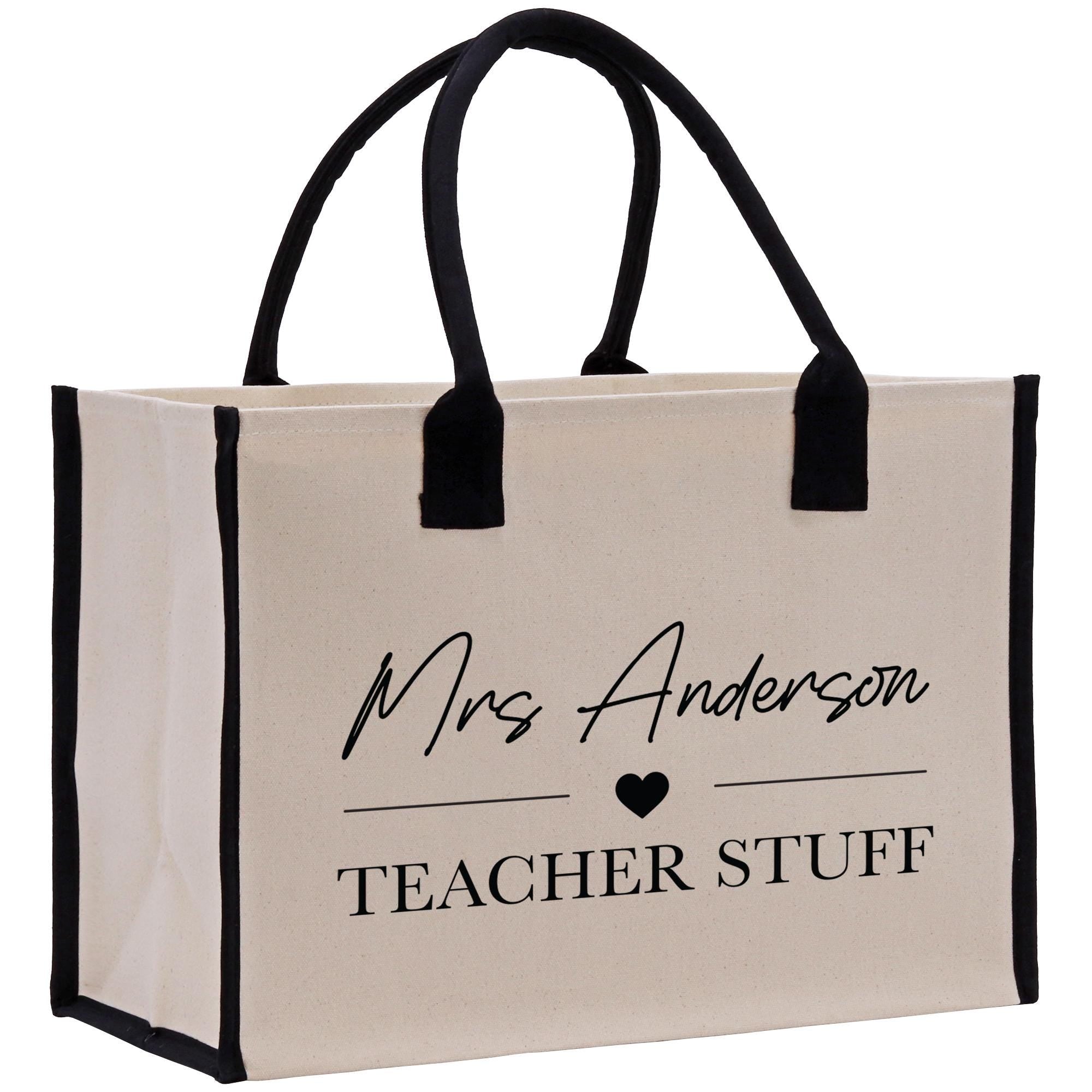 a white and black bag with a black handle
