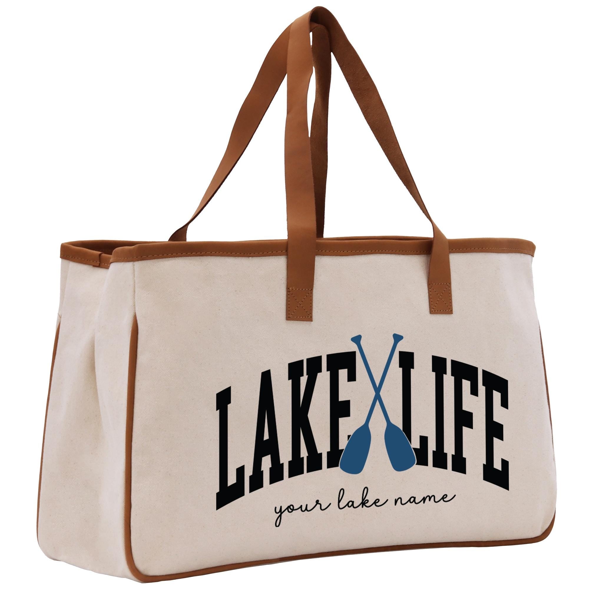 a white bag with a brown handle and a lake life logo on it