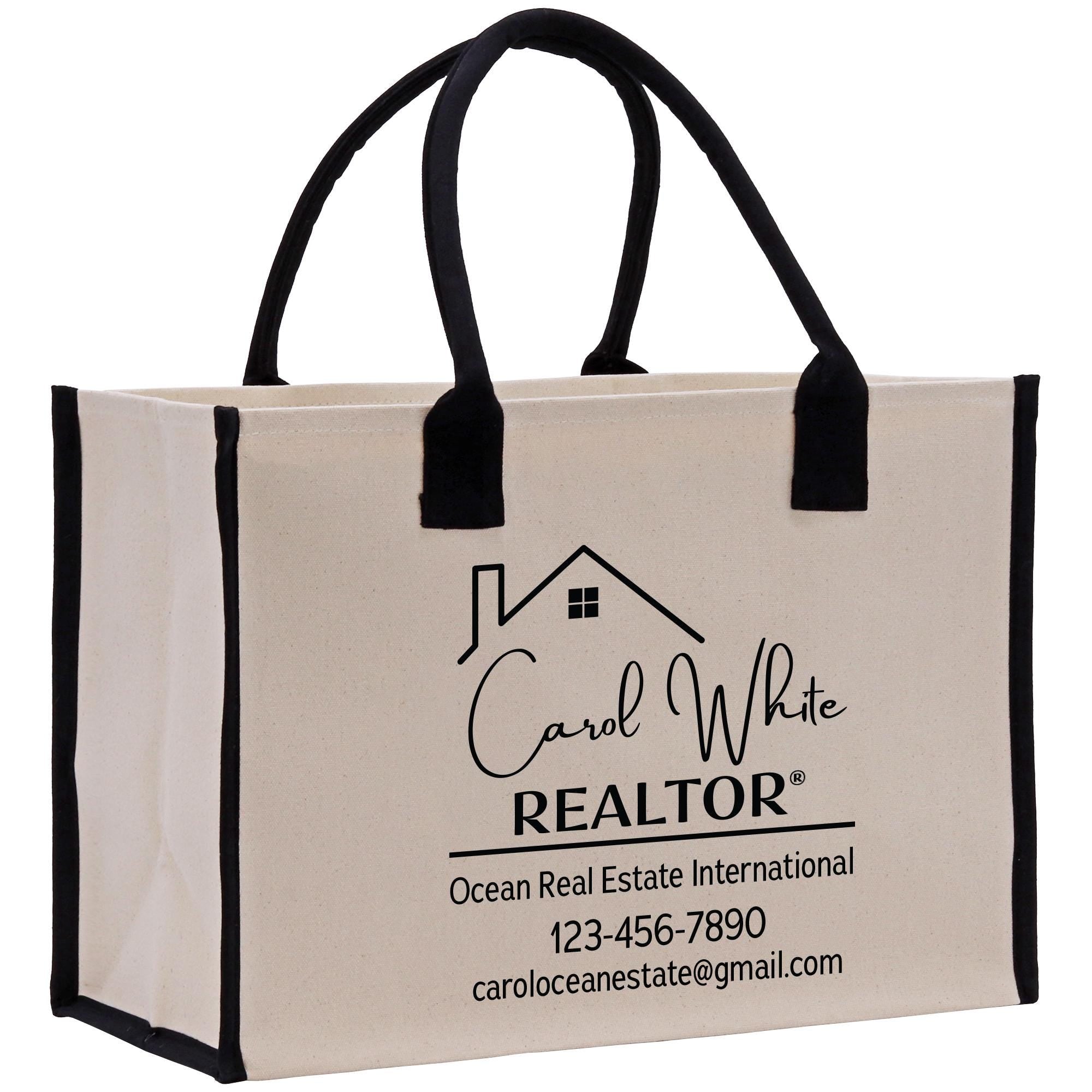 a white bag with black handles and a house logo on it