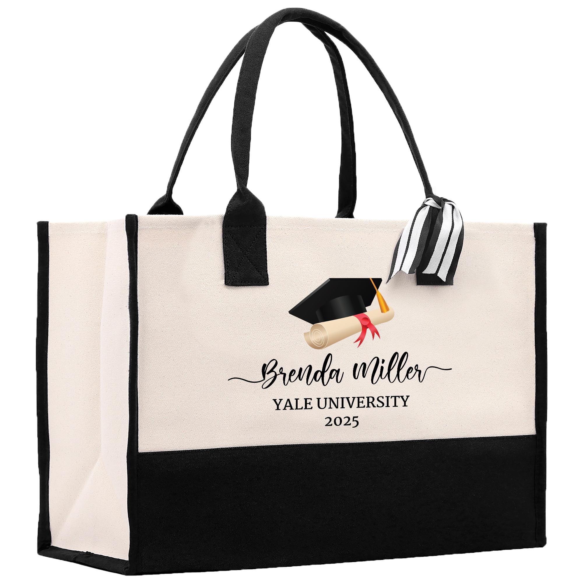 A beige tote bag with a graduation cap and mortarboard printed on it, along with the text &quot;Benda Miller Yale University 2020&quot;.