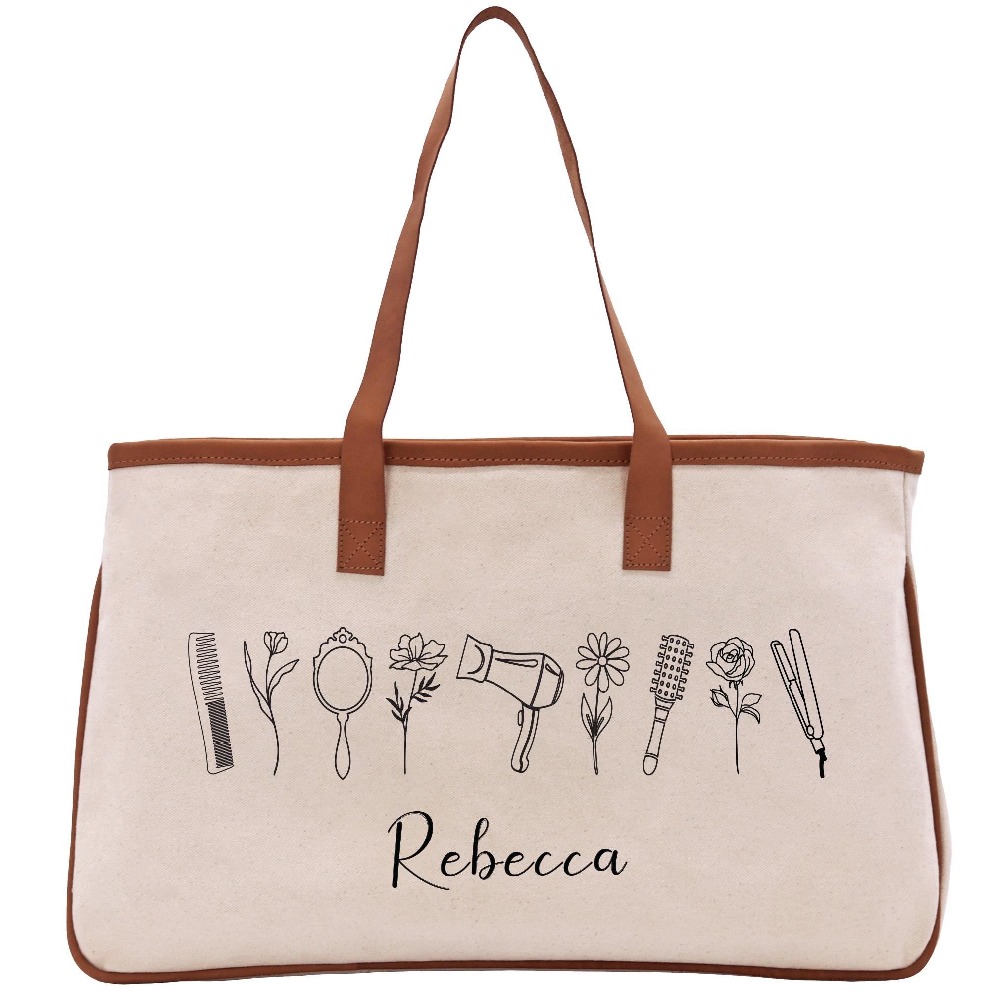 A beige canvas tote bag with a brown leather strap and the name &quot;Recca&quot; printed on it.