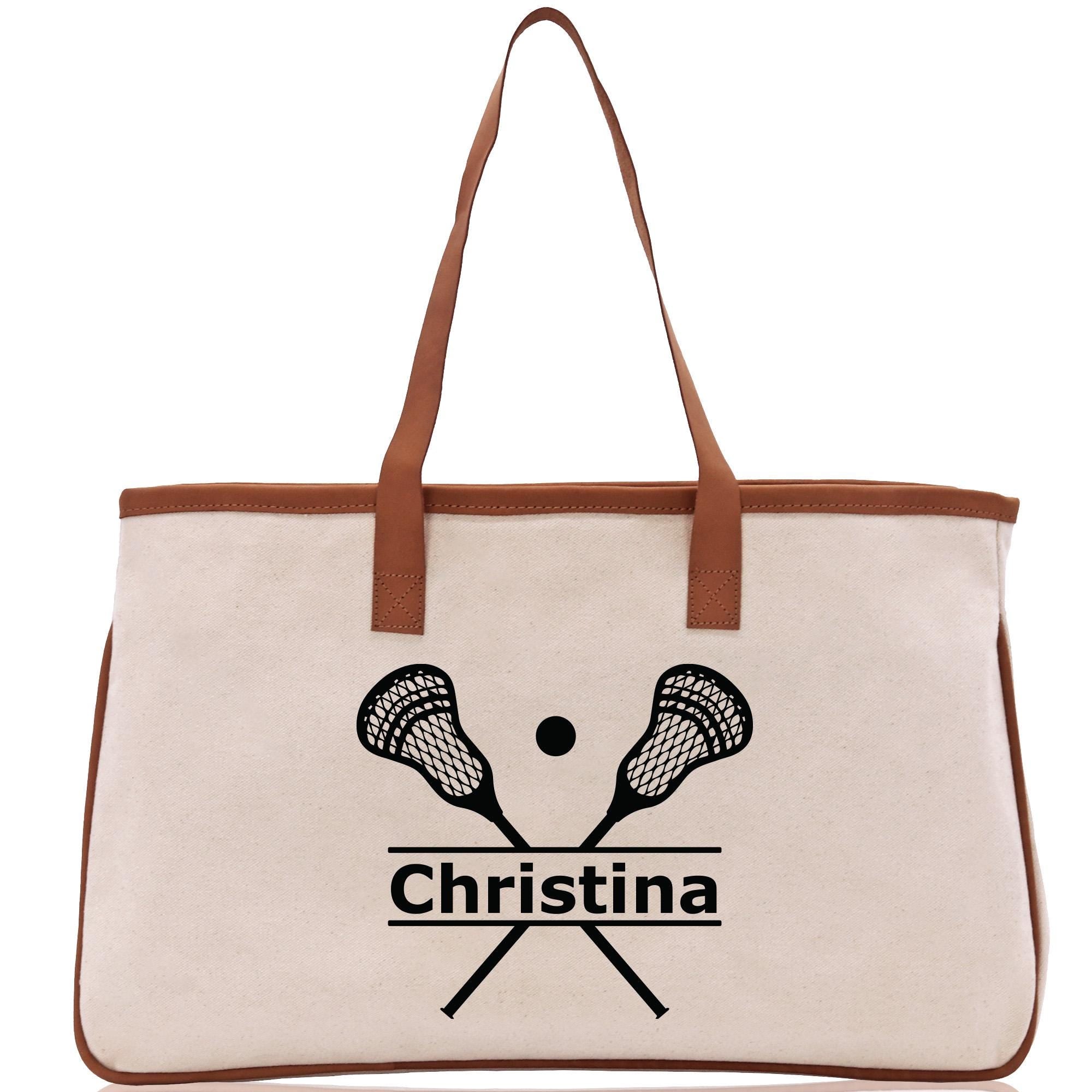 a white bag with a brown handle and two tennis rackets on it