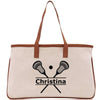 a white bag with a brown handle and two tennis rackets on it