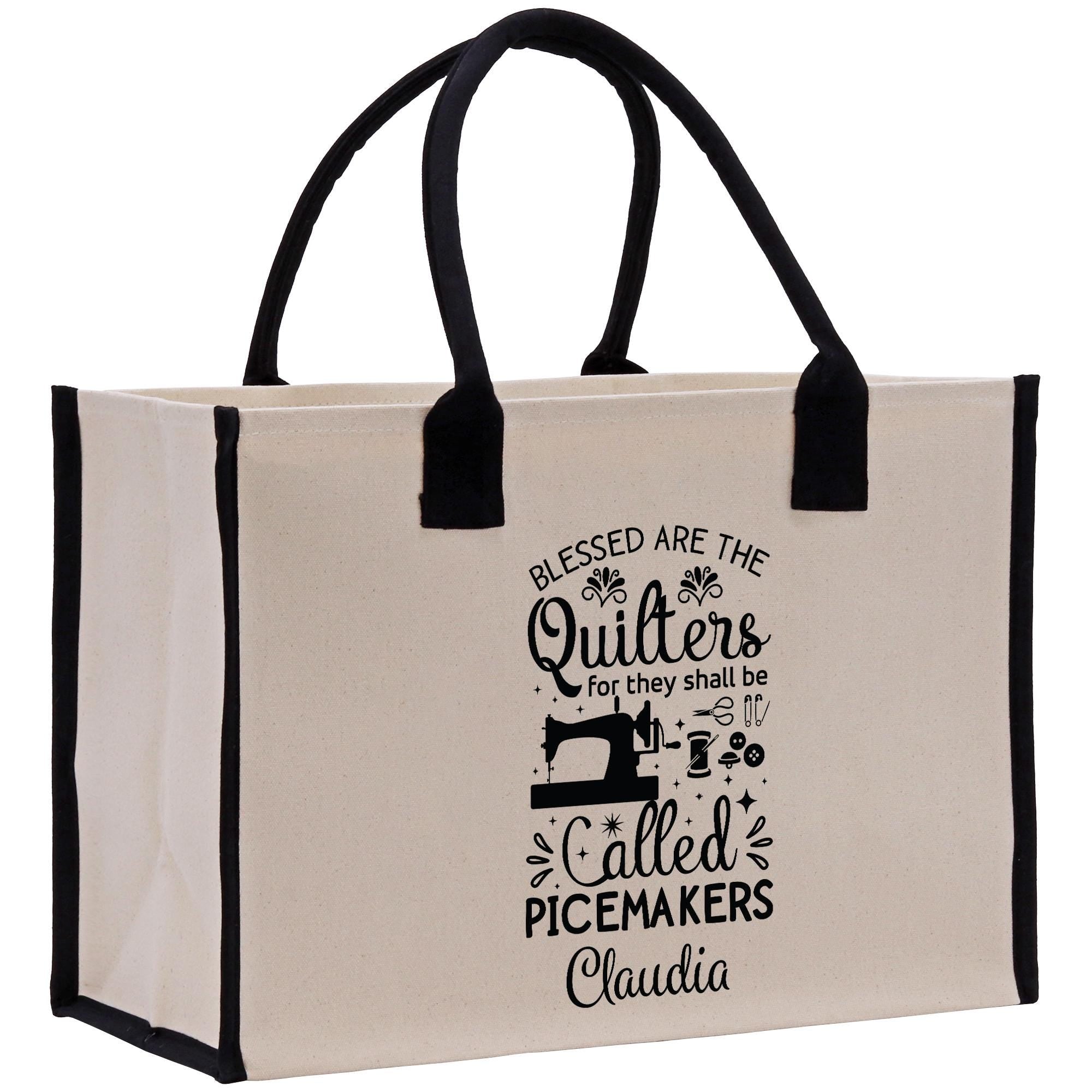 a white bag with black handles and a black handle