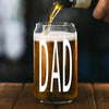 A glass of beer with the word "DAD" printed on it, with a stream of beer being poured into the glass.