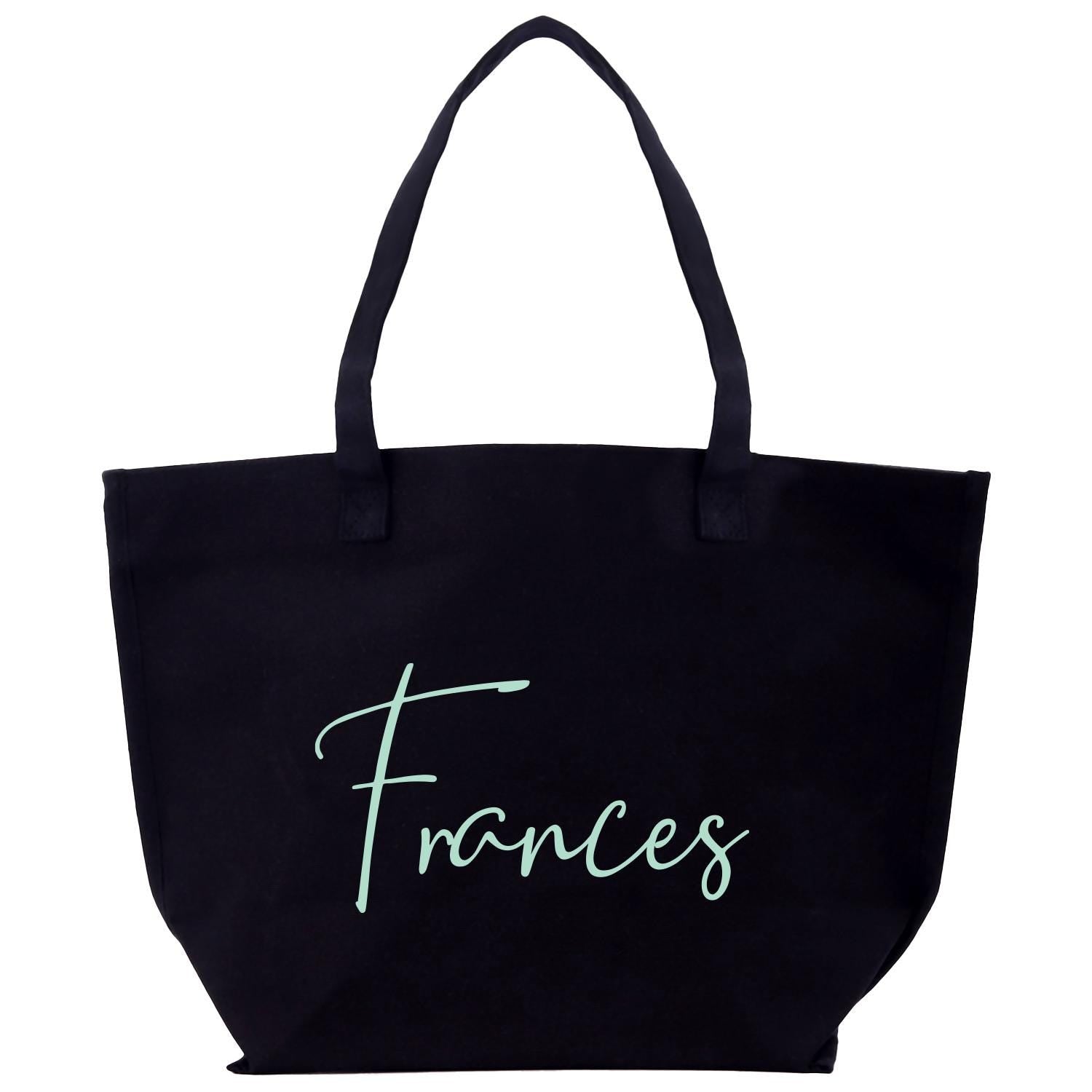 a black tote bag with the word frances on it