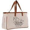 a canvas tote bag with a brown leather handle