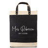 A black and beige tote bag with the text 