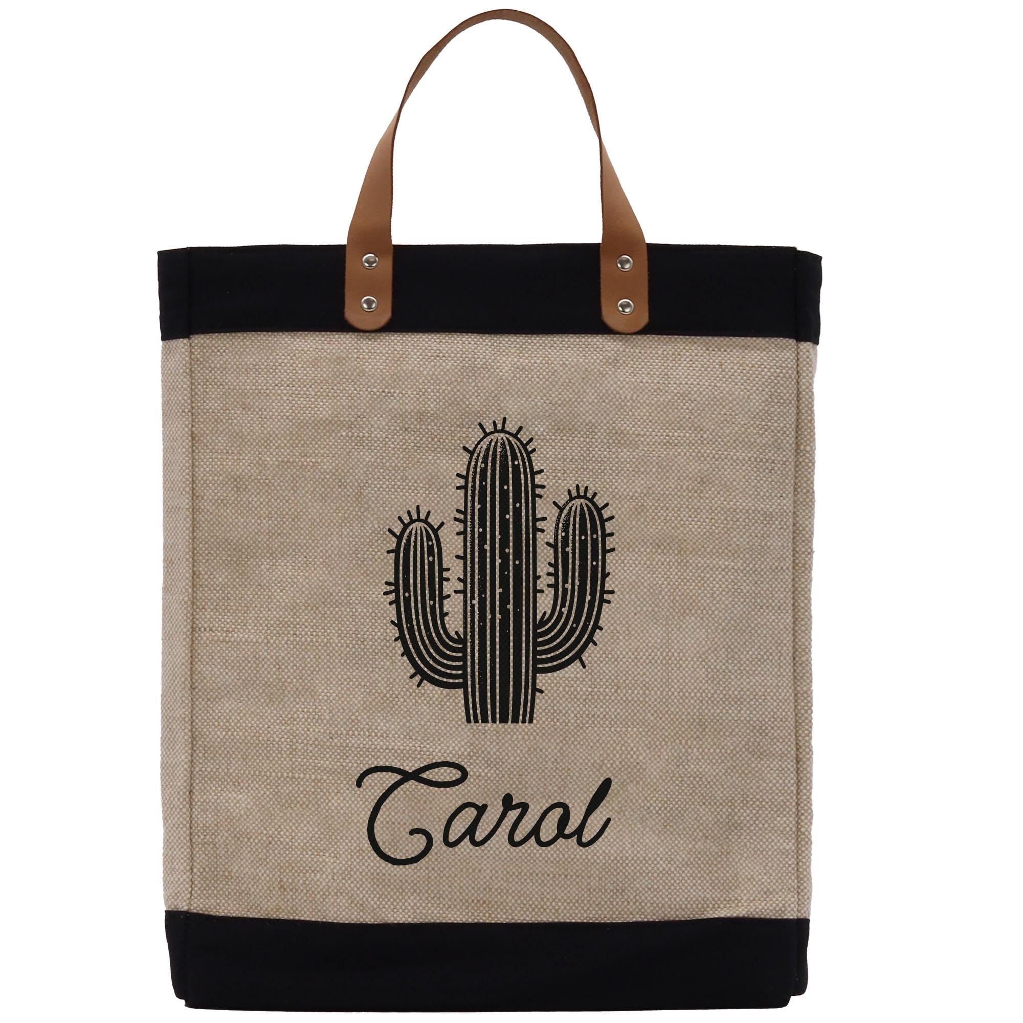 A beige tote bag with a black handle and a black cactus design printed on it. The bag has a black strap and the name &quot;Carol&quot; printed below the cactus design.