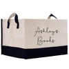 a black and white shopping bag with the words ashley's books written on
