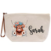 A beige canvas bag with a printed design of a cow's head wearing a floral crown and surrounded by flowers. The name "Sarah" is written in cursive below the cow's head.