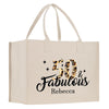 a white shopping bag with a leopard print